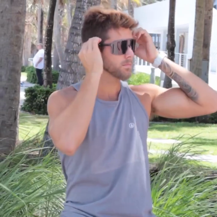Man keeping sunglasses in place while staying active outdoors with Fixoo grips